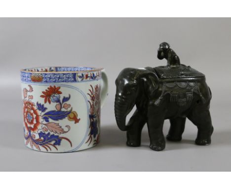 A patinated spelter box formed as an elephant with a monkey sat on its back along with an antique Spode tankard decorated in 