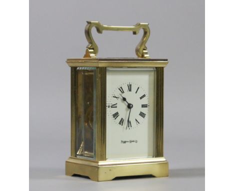 A Mappin & Webb brass cased carriage clock with fluted supports.