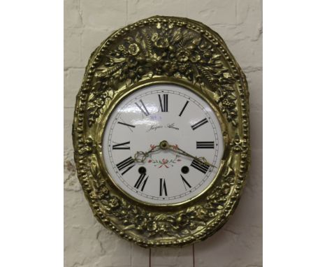 A 20th century French brass and enamel faced wall clock chiming half-hourly on a gong by Jacques Almar.