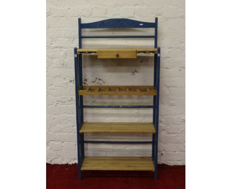 A painted free standing kitchen shelf unit.