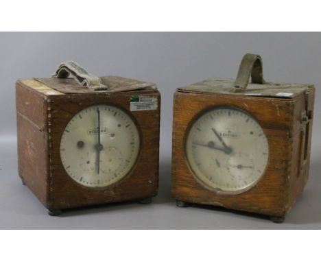 Two cased racing pigeon clock timing machines.