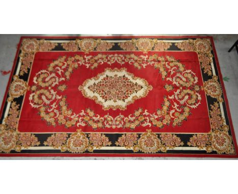 A large 20th Century Persian floor carpet rug. Central red ground with large medallion surrounded by geometric borders. Measu