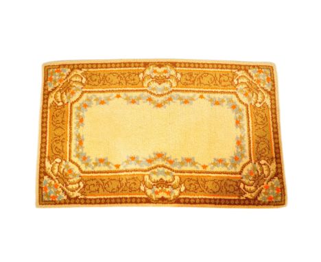 A vintage 20th century Persian Islamic floor carpet rug having earthy ground colours with floral stylised patterns encapsulat