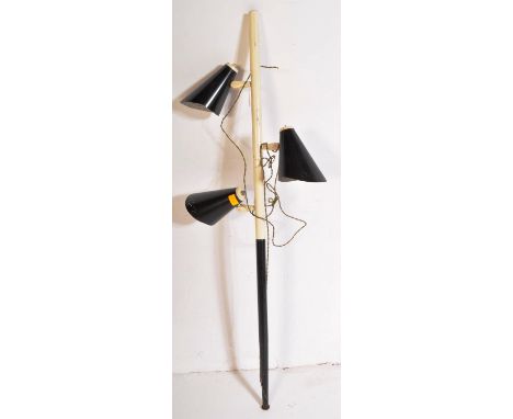 A retro vintage mid 20th Century 1950s floor standing adjustable lamp light having a tapering two tone stem with three black 