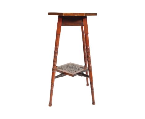 An early 20th century Edwardian era circa. 1900's mahogany carved jardinière in the manner of Liberty &amp; Co. The jardinièr