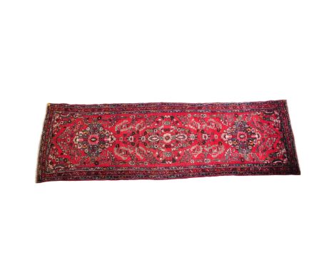 A 20th century Persian&nbsp;Gharadjeh type runner rug. The rug having red ground with intricate central medallions and floral