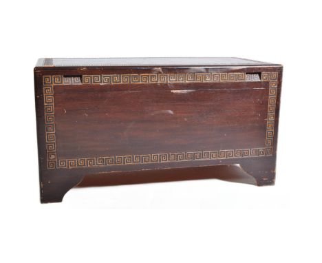 A vintage mid 20th Century camphor wood Chinese blanket box chest trunk. Of rectangular form with scrolled geometric repeatin