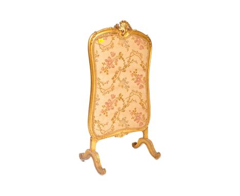 A 19th Century gilt wood worked fire screen - discretion panel. Comprises a glazed embroidered tapestry panel within show woo