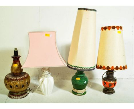 Four vintage retro mid 20th century West German pottery lamp to include fat lava, Two with German cone shades and another wit