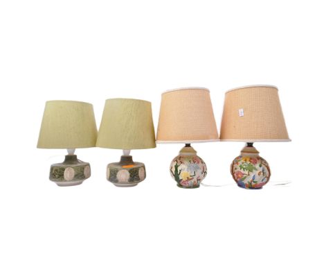 A pair of mid 20th Century Jersey pottery table lamps, complete with two green lamp shades. Together with two other mid 20th 