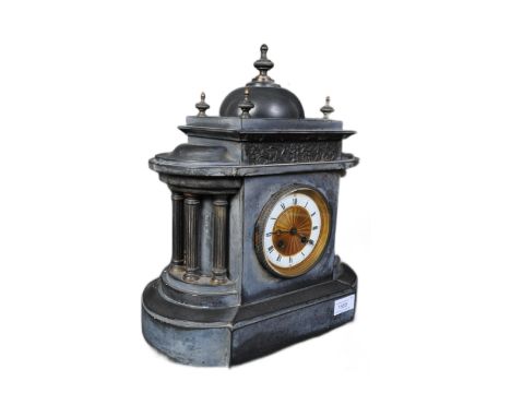 A 19th Century slate mantel striking clock. With a dome top with finial surround by another four finial. arched flanked tops 