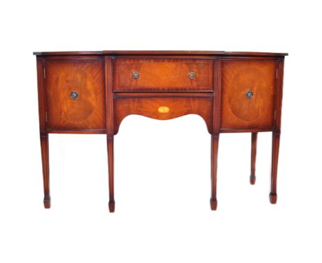 A 20th century Regency revival mahogany sideboard credenza. The sideboard having inlaid and crossbanded top over breakfront f