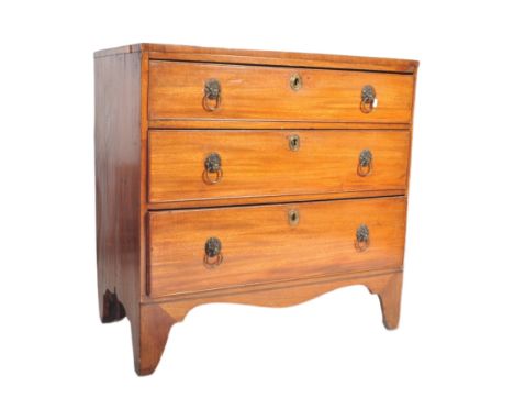 An early 19th century George III mahogany bachelors chest of drawers having a bank of three drawers, each with metal moulded 