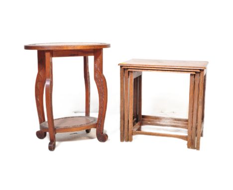 A 20th century oak wood nest of tables alongside a carved wood jardinière plant stand.&nbsp;Measures approx. 61cm x 53cm x 35