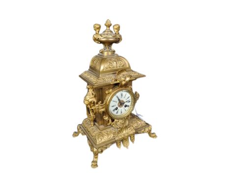A 20th century French Louis XIV style gilt brass table mantel clock having a top finial with harpies to the sides over an 8 d