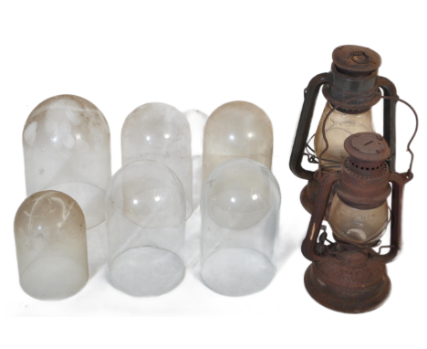Two early 20th century gas lamp lanterns together with a collection of glass clock / specimen domes.&nbsp;