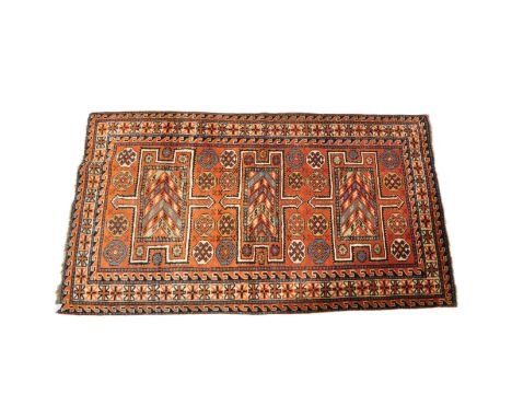 A vintage mid 20th century Persian Islamic Goltoch wool floor carpet rug with central geometric medallions with repeating pat