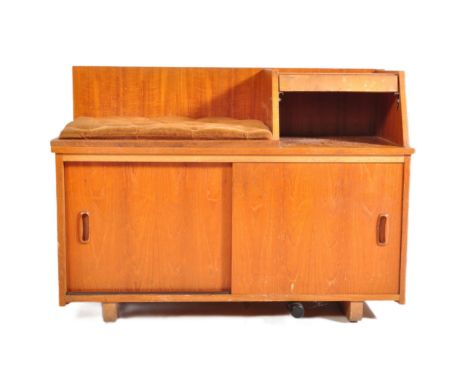 Mid century teak wood telephone hall settle cabinet. Upholstered seat with raised stand and open shelf being over twin slidin