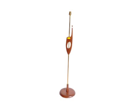 A retro vintage mid 20th century Danish inspired teak floor standing standard lamp having abstracted concaved details to shaf