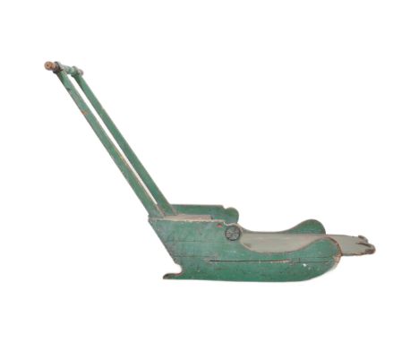 An early 20th century Scandinavian wooden painted sled. / sleigh Green painted pine with sleigh runners, plank seat and handl