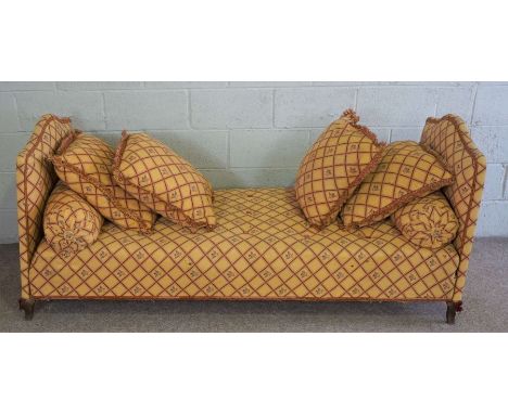 A French style day bed, with arched ends, currently upholstered in gold with a red trellis stripe, including cushions, 200cm 