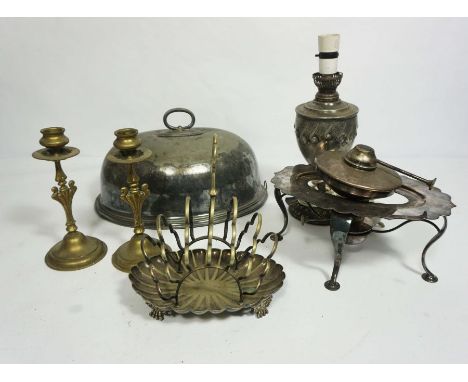 A quantity of silver plate and metal wares, including a pair of brass candlesticks, a converted oil lamp of baluster form; an