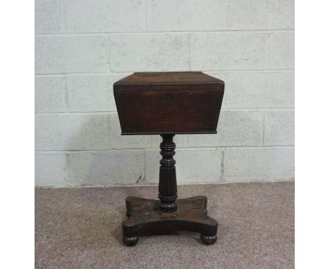 A William IV rosewood teapoy, circa 1830, in the manner of Gillows of Lancaster, with a sarcophagus caddy top, opening to rev