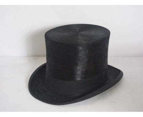 A black silk top hat, by D.M. Dunlop, with cardboard caseCondition reportHat is in generally excellent condition, with no tea