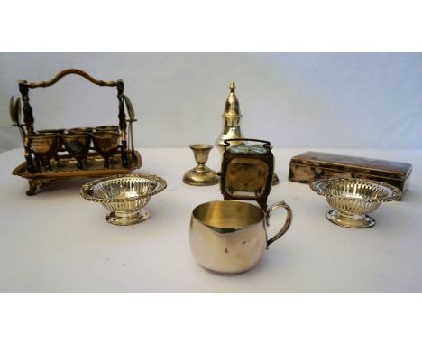 Assorted silver plate, including a pair of bon bon dishes, a cigarette box, a pair of squat candlesticks, an egg stand, and a