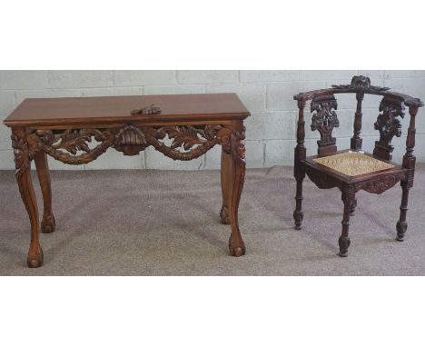 A Victorian style carved hardwood corner chair, with double eagle head carved splats and a caned seat; together with a simila