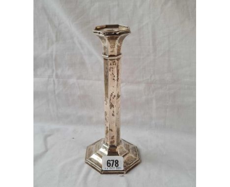 A singular candlestick of octagonal form - 8" high - Birmingham 1933 