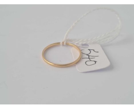 A small narrow 14ct gold wedding band size K ½ 0.7g