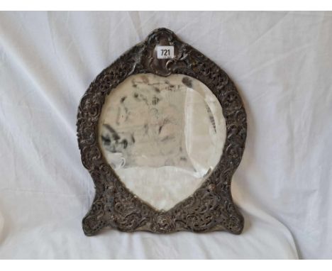 A large easel shaped dressing table mirror with heart shaped mirror panel, embossed scroll boarder and vacant cartouche, 17.5