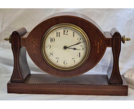 An Edwardian mantel clock in an inlaid mahogany case. 6.5" high.