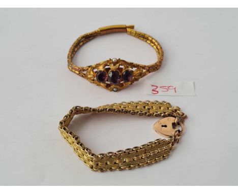 A Victorian gold coloured metal bracelet stone set and Edwardian fancy gold coloured metallic gate bracelet 
