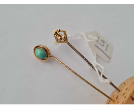 Two gold stick pins including a turquoise example 