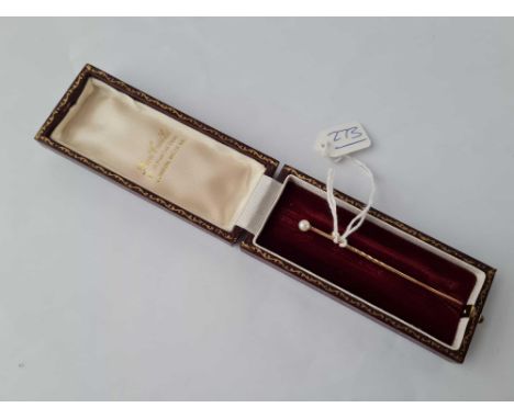 A cased pearl and gold stick pin 