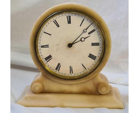 An alabaster cased clock with circular dial, the movements stamped VAP Reveter with dead beat escapement and instructions. 