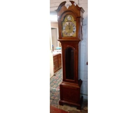 Another chiming long case clock in mahogany case with glazed door. 7' high.