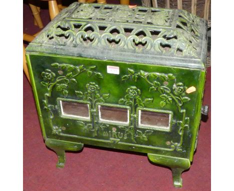 A French Art Deco green enamel decorated cast iron freestanding stove by Mirus, w.47cmCondition report: In good condition, bu