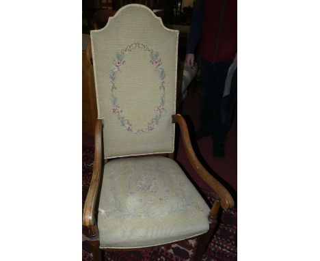 An Edwardian mahogany and satinwood inlaid open armchair, having floral needlework tapestry upholstered pad back and stuff ov