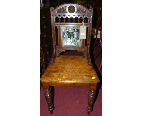 A Victorian oak panelled seat hall chair, having ceramic inset tile back titled 'The Talisman Sir Kenneth &amp; The Dwarf', r