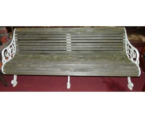 A Victorian style white painted, pierced and cast metal framed teak slatted four seater garden bench, width 200cm