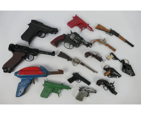 Lone Star - A loose collection of vintage cap guns and toy guns. Lot includes a scarce circa 1950's  Limit Spaceman tinplate 
