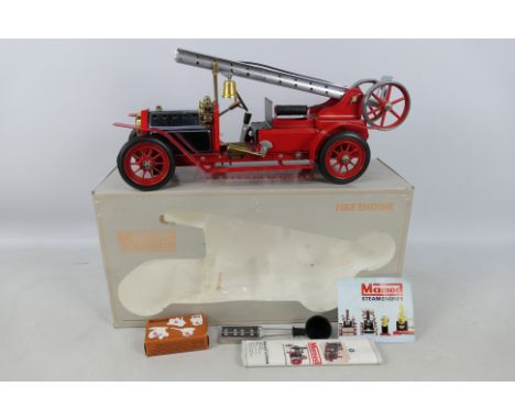 Mamod - Unsold Shop Stock - A boxed Mamod Steam Fire Engine # FE1. The model appears in Mint condition with accessories and i