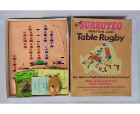 Subbuteo - A boxed 1970s International Table Rugby set and a carded TV Unit set # C156. The set is incomplete but the items a