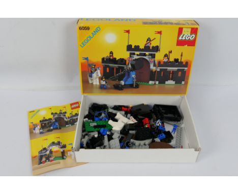 Lego - A boxed vintage 1990 Lego #6059 'Knights Stronghold' set. The set has been opened with original seal still present at 
