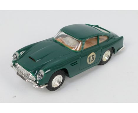 Scalextric - An unboxed Aston Martin DB4 GT # MM/C68. The model appears in Very Good condition with only light signs of use. 