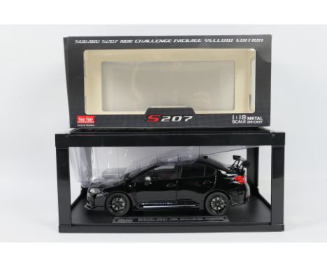 Sun Star - A boxed Sun Star #5553 1:18 scale diecast Subaru S207 NBR Challenge Package Yellow in black. The model appears to 