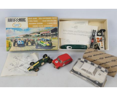 Airfix MRRC - 4 x rare Airfix slot cars in 1:32 scale, a boxed Indi-Novi-Ferguson # 727, A Lotus Cortina # 5166, a Mini Coope